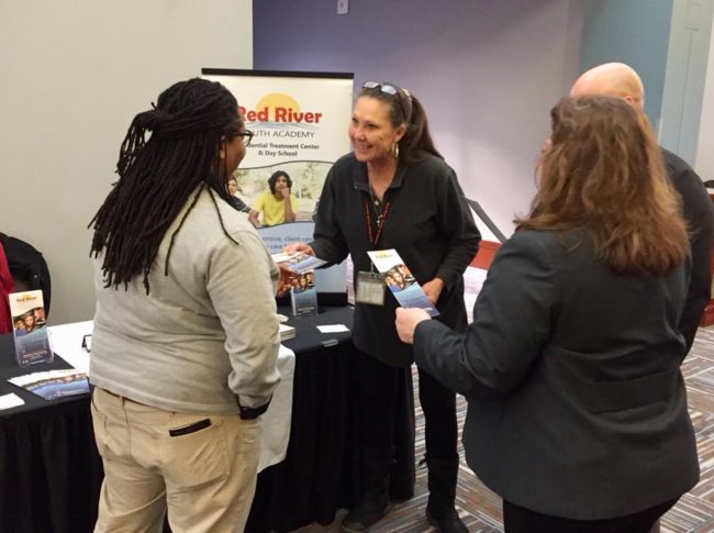 red river youth academy conference booth